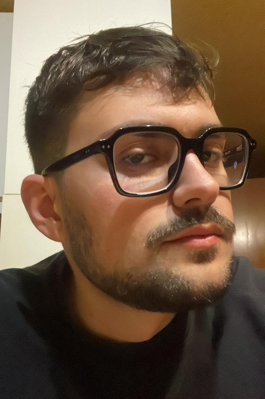 Jacopo Pierantozzi, a blockchain developer, captured in a professional portrait with a soft grayscale effect.