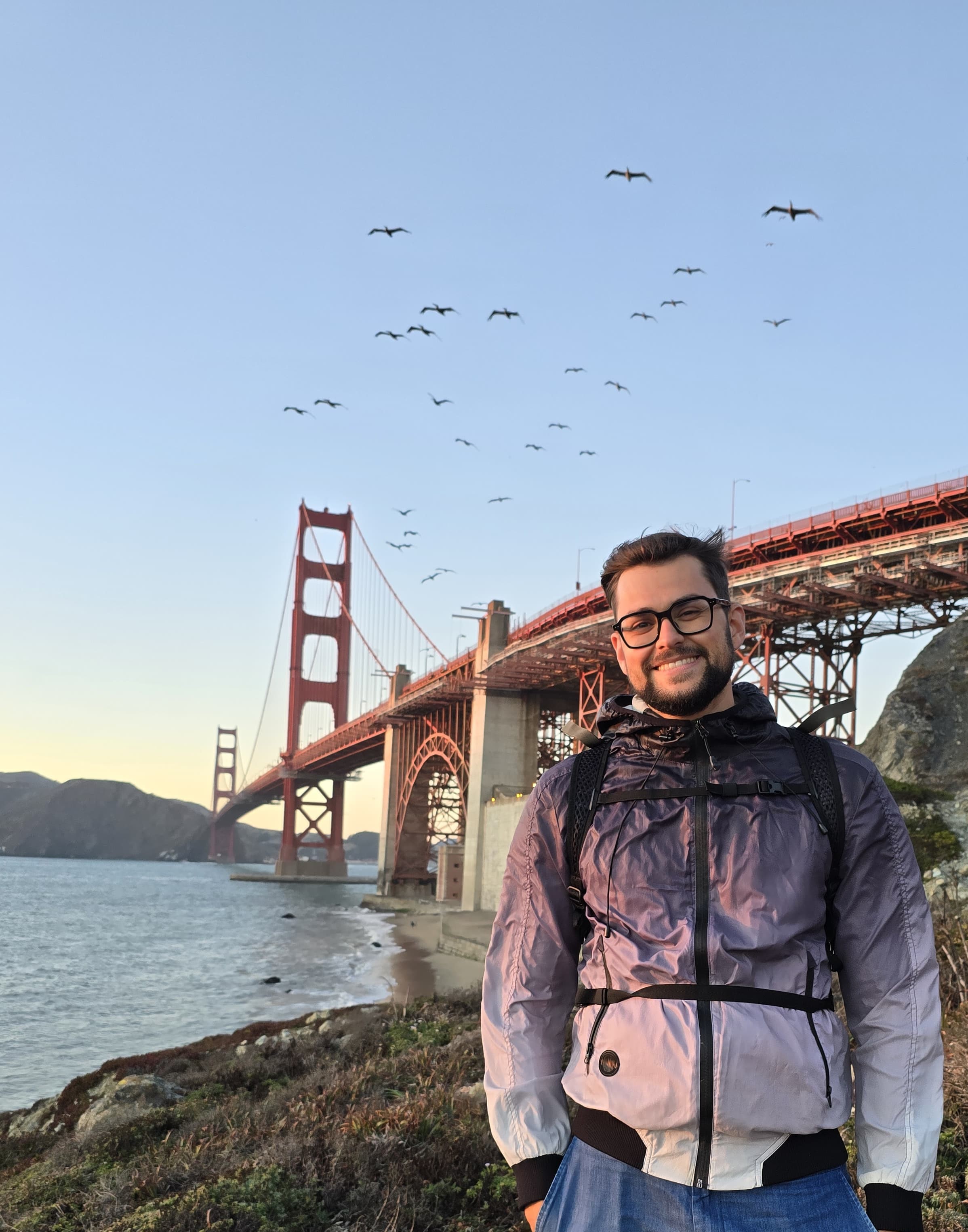 Jacopo Pierantozzi, a blockchain developer, posing with a confident smile against a blurred background.